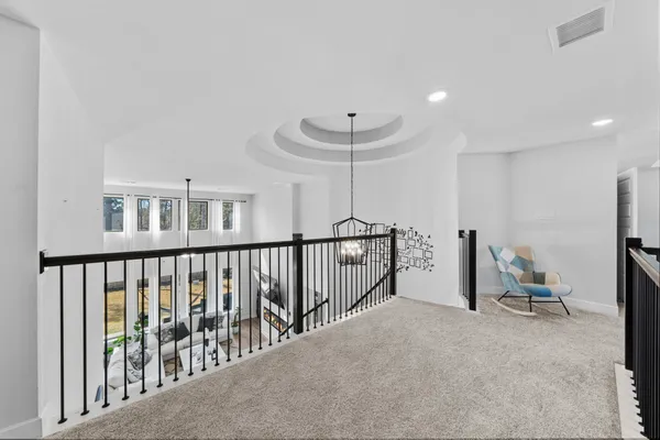 a view of a hallway with seating area