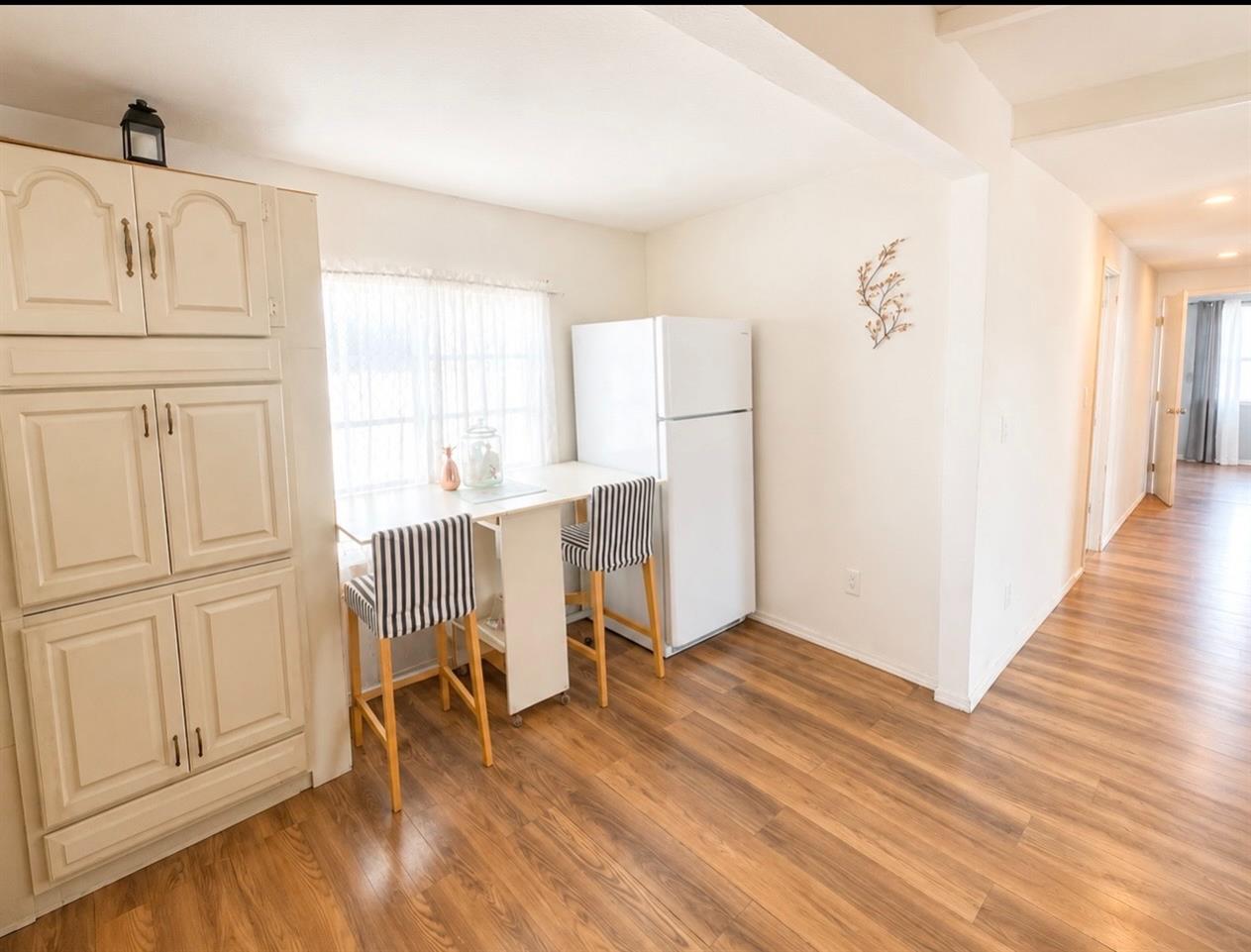 5000 Pierce Road, Unit 32 Bakersfield, CA 93308 - Photo 5 of 15 a view of a livingroom with wooden floor and entryway