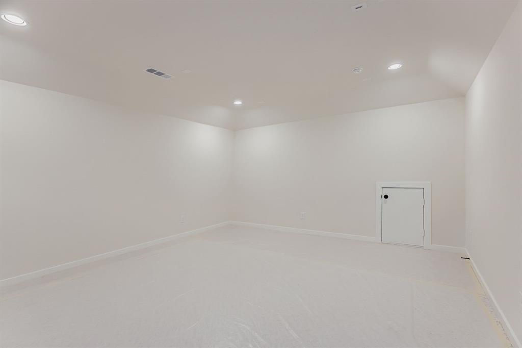 3324 Little Bluestem Road Celina, TX 75009 - Photo 26 of 29 Empty room with light colored carpet and recessed lighting