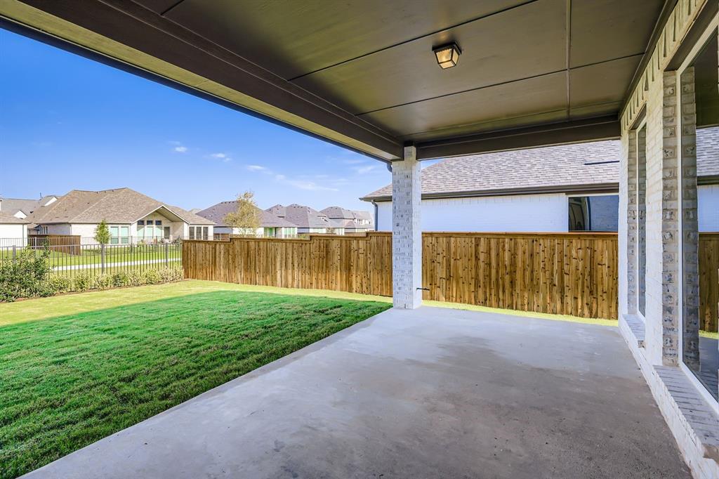 3324 Little Bluestem Road Celina, TX 75009 - Photo 28 of 29 Fenced backyard featuring a residential view and a patio area