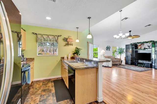 a view of a kitchen and dining room
