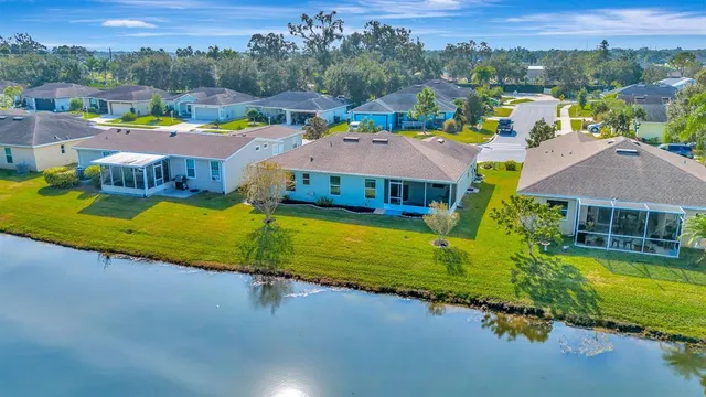 a view of a town with pool and lake view