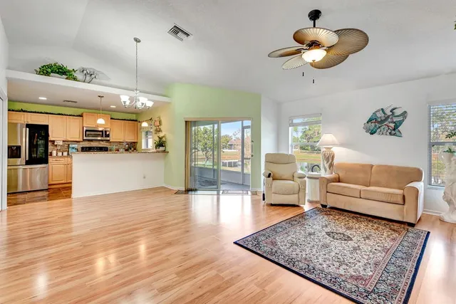 a view of a living room and kitchen