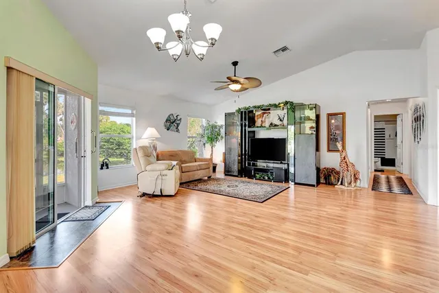 a living room with furniture fireplace and flat screen tv
