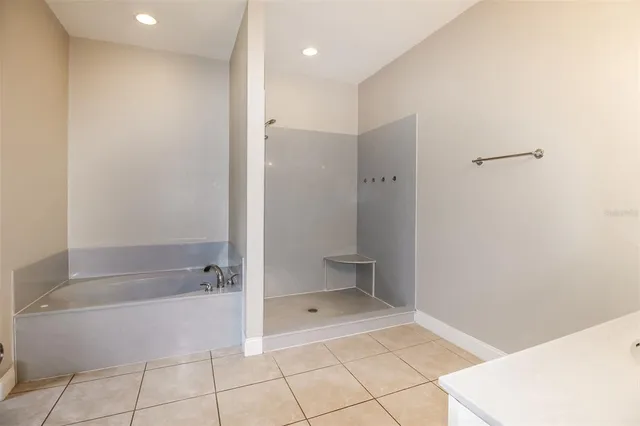 a bathroom with a bathtub and a shower