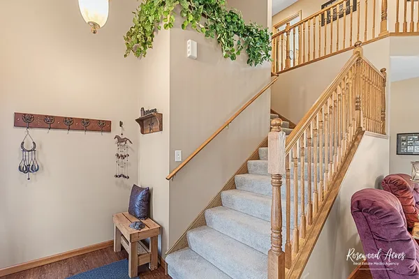 a view of entryway with wooden floor