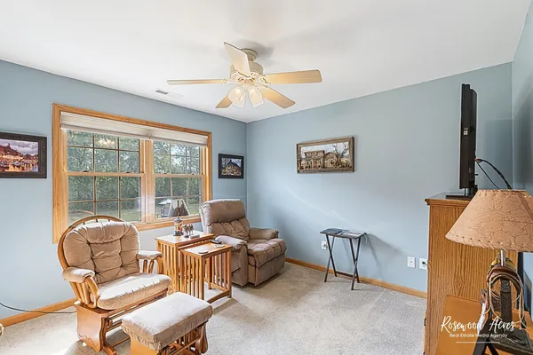 a work room with furniture and a window