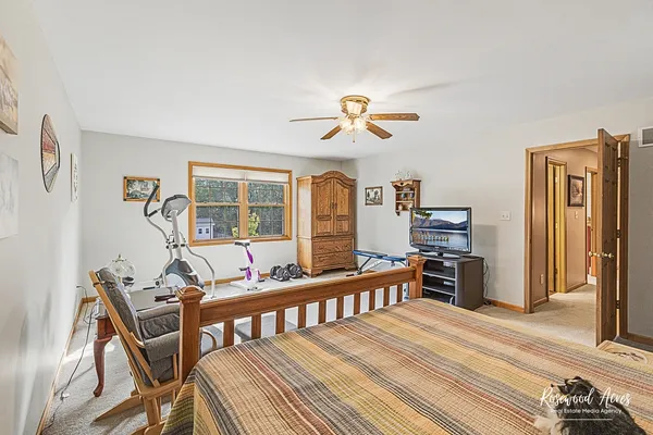 a bedroom with furniture and a window