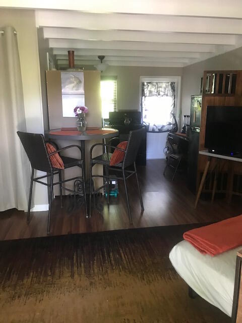 1703 Johnson Street, Unit B Key West, FL 33040 - Photo 8 of 10 a view of a dining room with furniture window and wooden floor