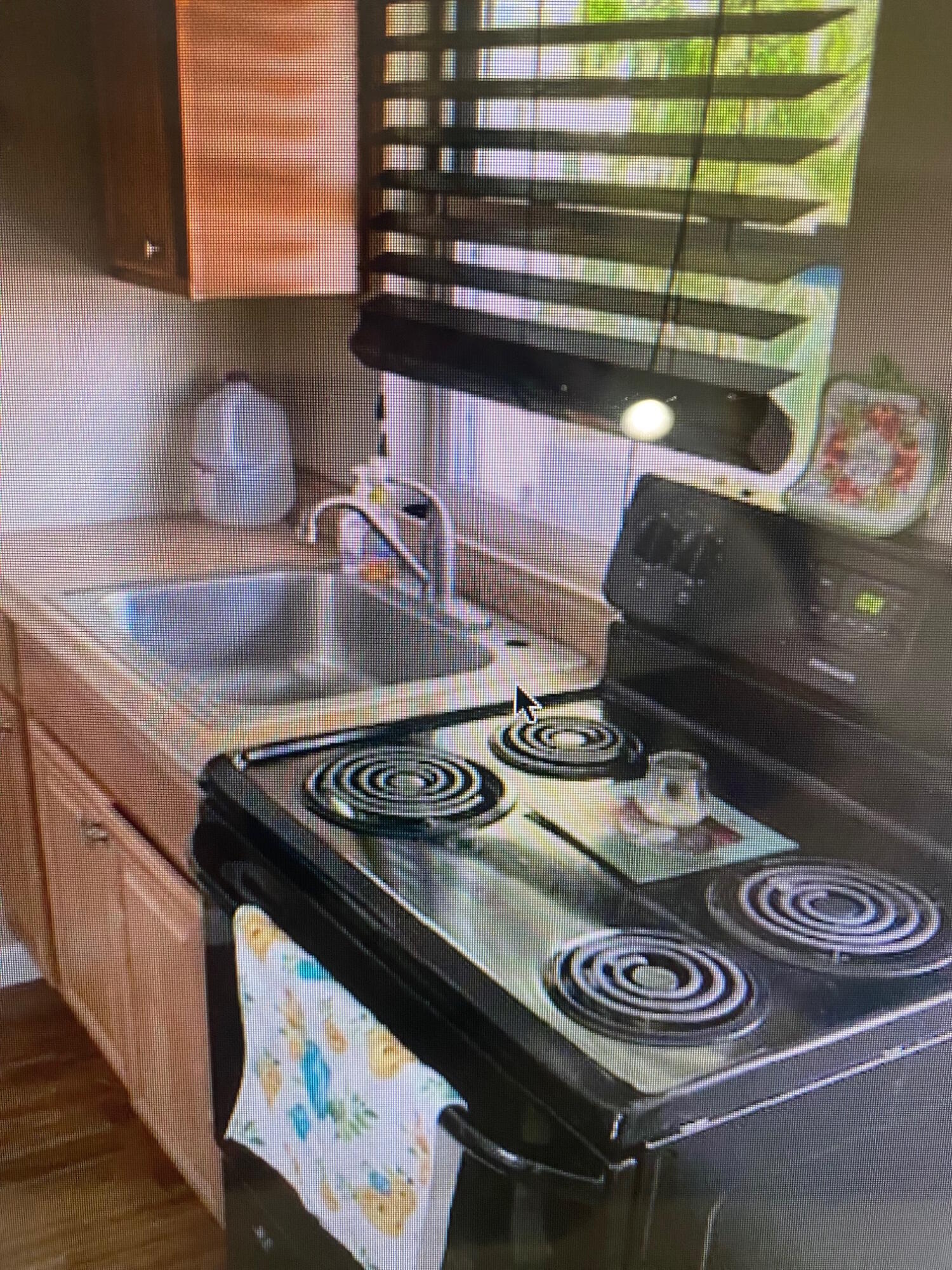 1703 Johnson Street, Unit B Key West, FL 33040 - Photo 9 of 10 a stove top oven sitting inside of a kitchen