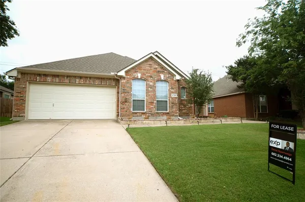 a front view of house with yard and outdoor seating
