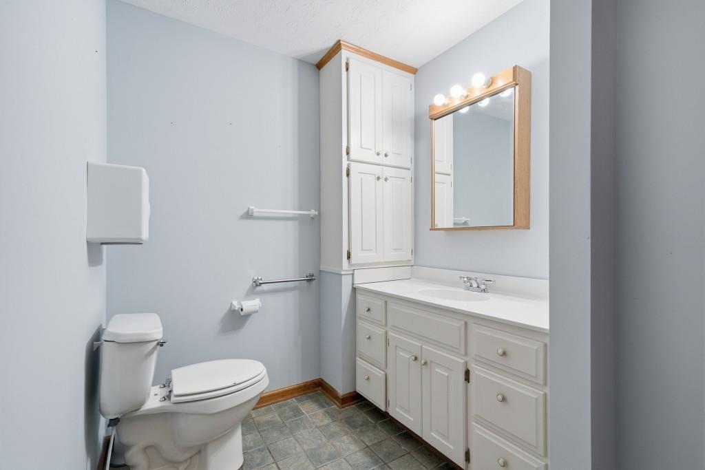 176 Big Oak Tree Road Northwest Adairsville, GA 30103 - Photo 31 of 77 a bathroom with a double vanity sink toilet and mirror