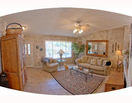 1431 Hawkwood Road Henderson, NV 89014 - Photo 3 of 12 Living Room. Custom Paint Throughout!