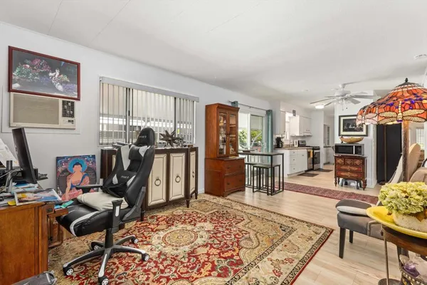 a view of a workspace with furniture and a livingroom