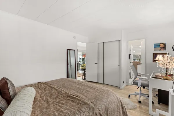a bedroom with a bed and a couch