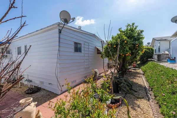 a view of a backyard with chairs