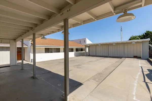 a view of backyard with outdoor seating and plants