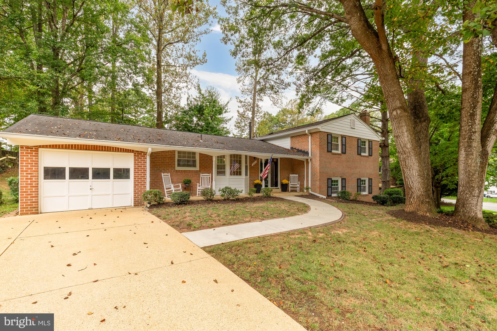 a front view of a house with yard patio and fire pit