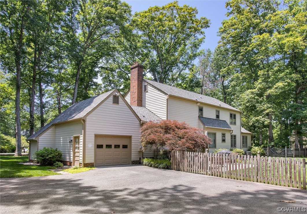 2301 Winterfield Road Midlothian, VA 23113 - Photo 13 of 50 a front view of a house with a garage