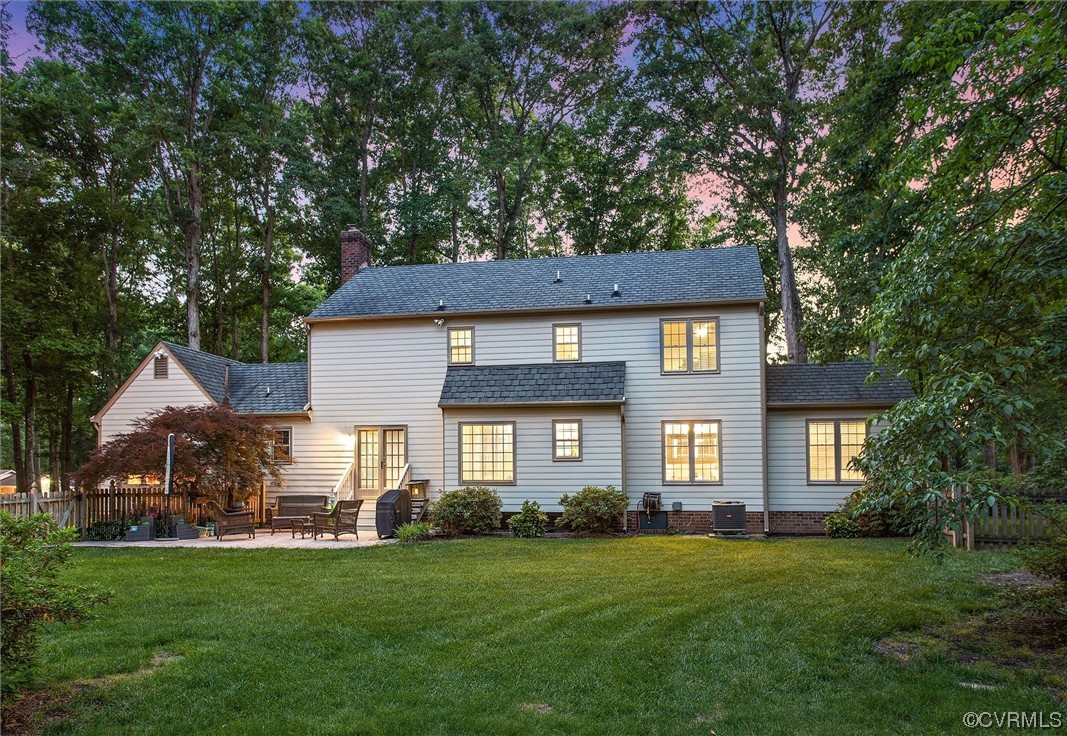 2301 Winterfield Road Midlothian, VA 23113 - Photo 16 of 50 a front view of a house with a garden