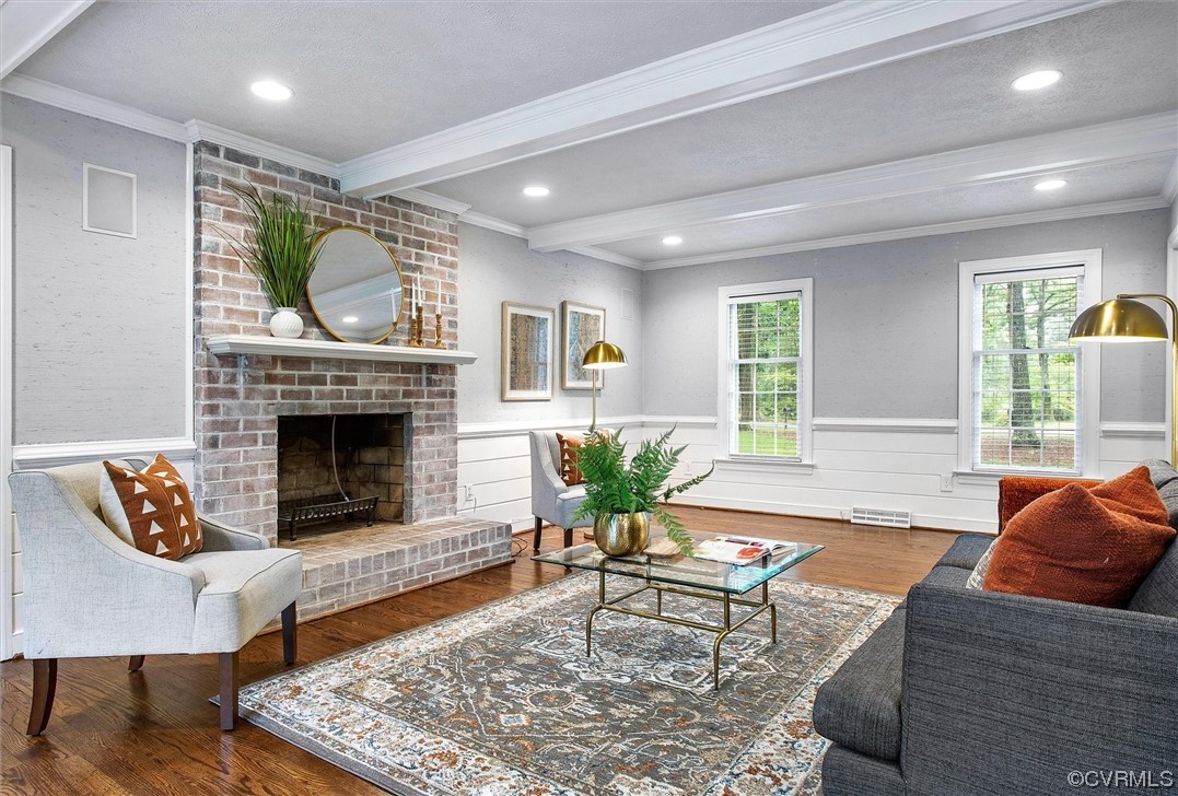 2301 Winterfield Road Midlothian, VA 23113 - Photo 20 of 50 a living room with furniture a rug and a fireplace