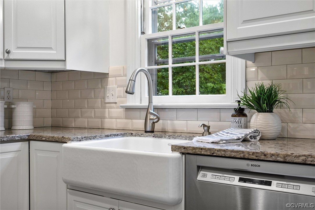 2301 Winterfield Road Midlothian, VA 23113 - Photo 26 of 50 a kitchen with granite countertop a sink and a window