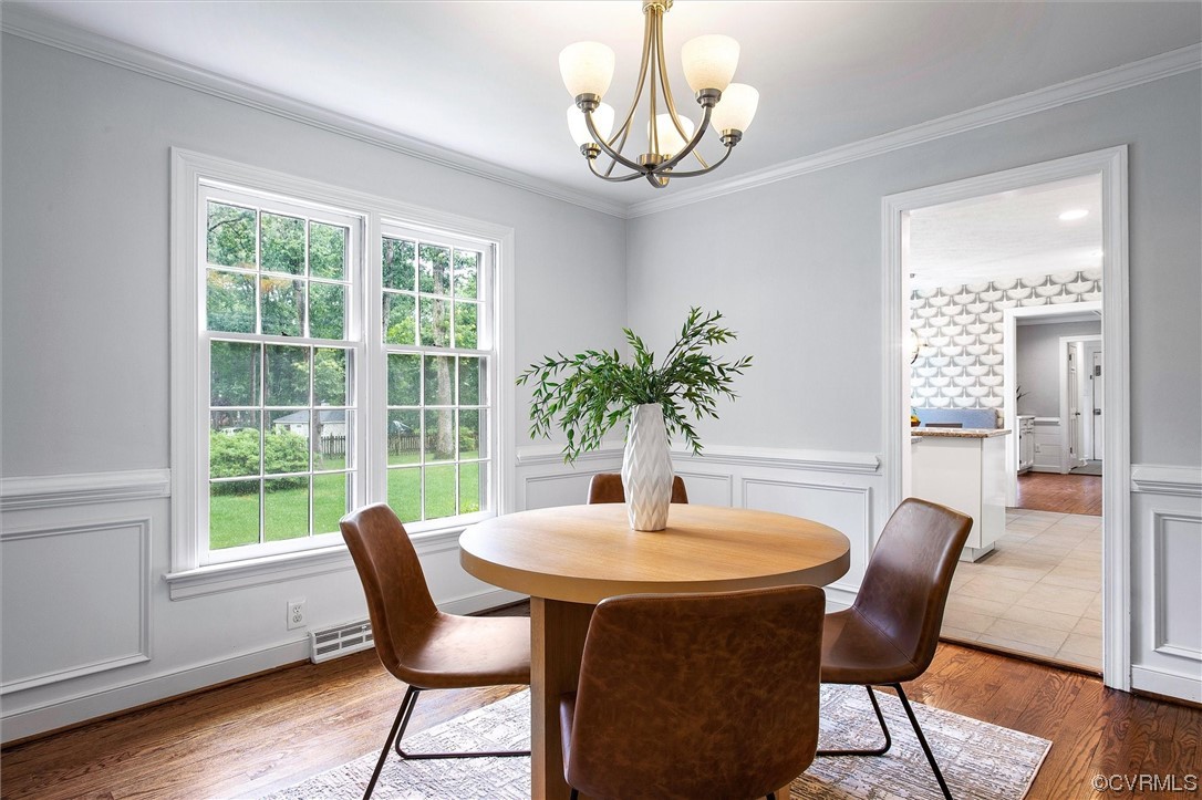 2301 Winterfield Road Midlothian, VA 23113 - Photo 29 of 50 a dining room with furniture window and wooden floor
