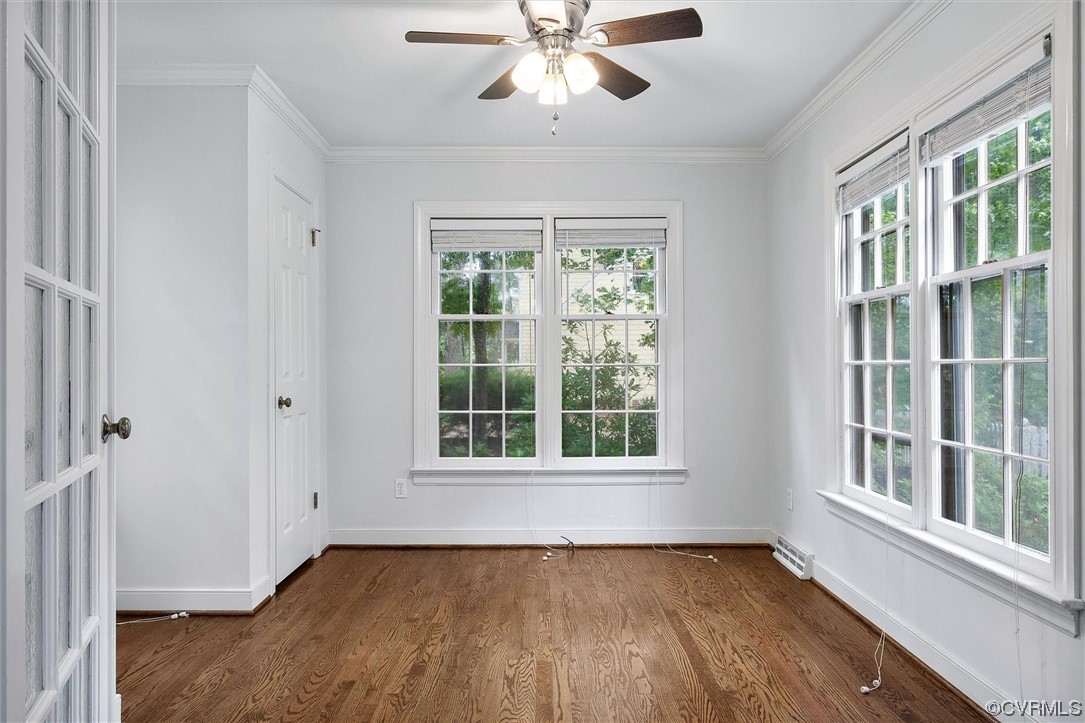 2301 Winterfield Road Midlothian, VA 23113 - Photo 30 of 50 a view of an empty room with wooden floor and a window