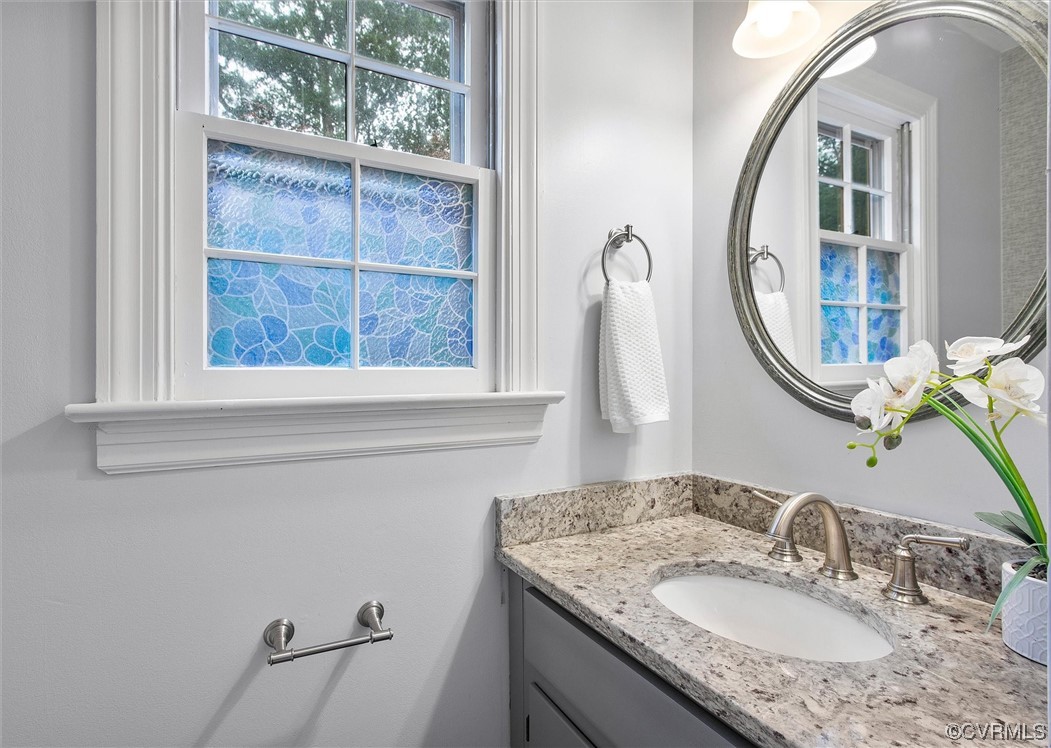 2301 Winterfield Road Midlothian, VA 23113 - Photo 34 of 50 a bathroom with a granite countertop sink and a mirror