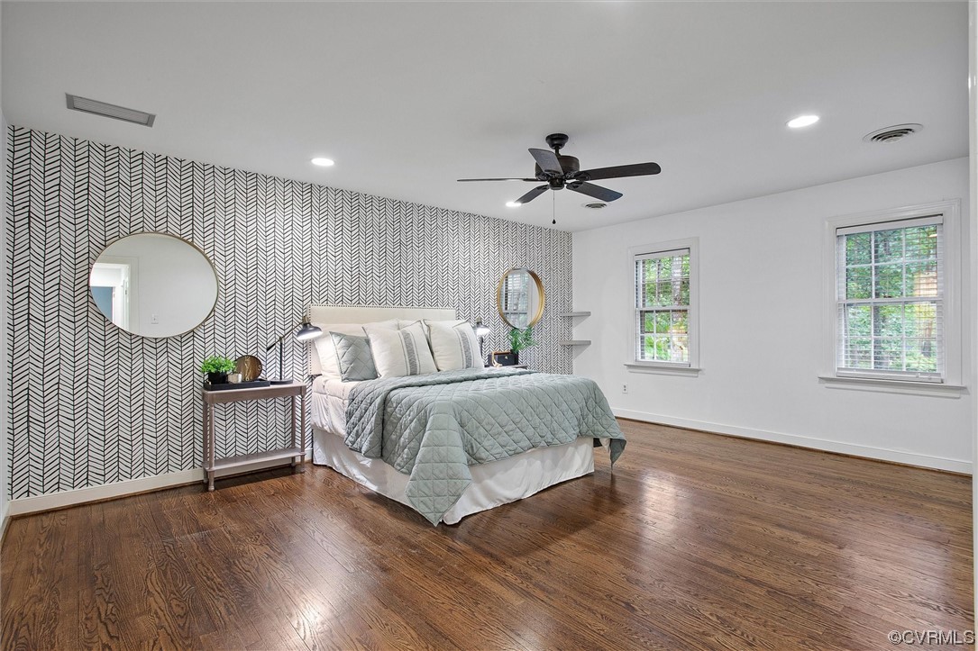2301 Winterfield Road Midlothian, VA 23113 - Photo 36 of 50 a spacious bedroom with a bed mirror on desk and a window