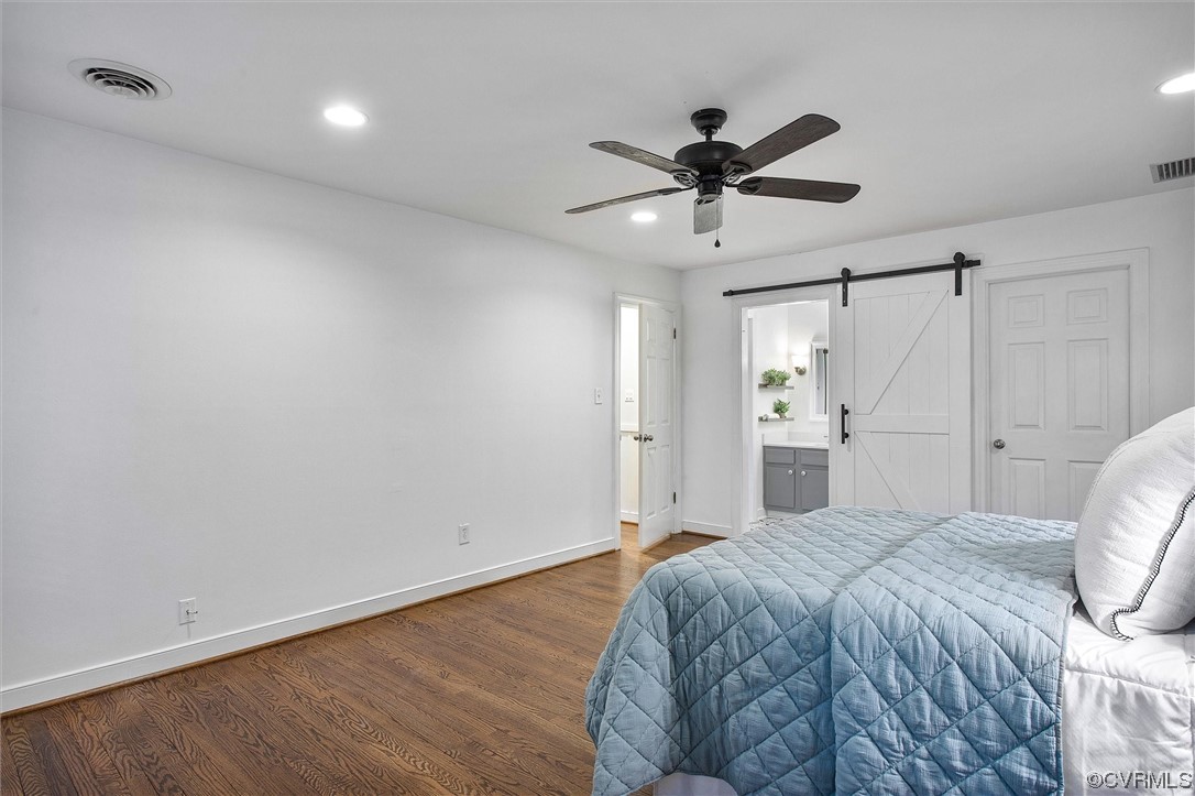 2301 Winterfield Road Midlothian, VA 23113 - Photo 37 of 50 a spacious bedroom with a bed and a ceiling fan