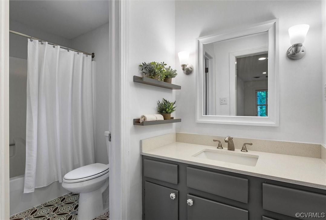 2301 Winterfield Road Midlothian, VA 23113 - Photo 38 of 50 a bathroom with a sink a toilet and shower