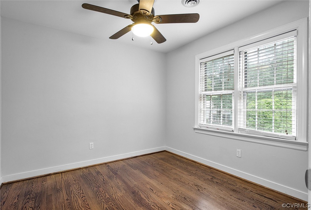 2301 Winterfield Road Midlothian, VA 23113 - Photo 40 of 50 an empty room with wooden floor fan and windows