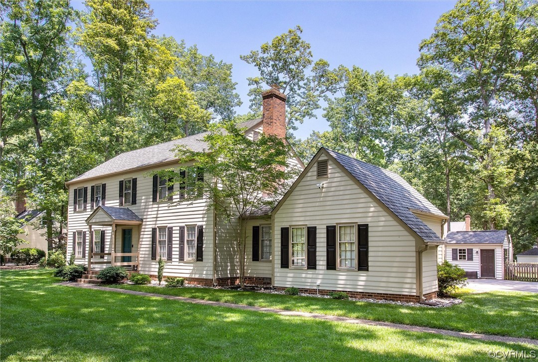 2301 Winterfield Road Midlothian, VA 23113 - Photo 4 of 50 a front view of a house with a yard and trees