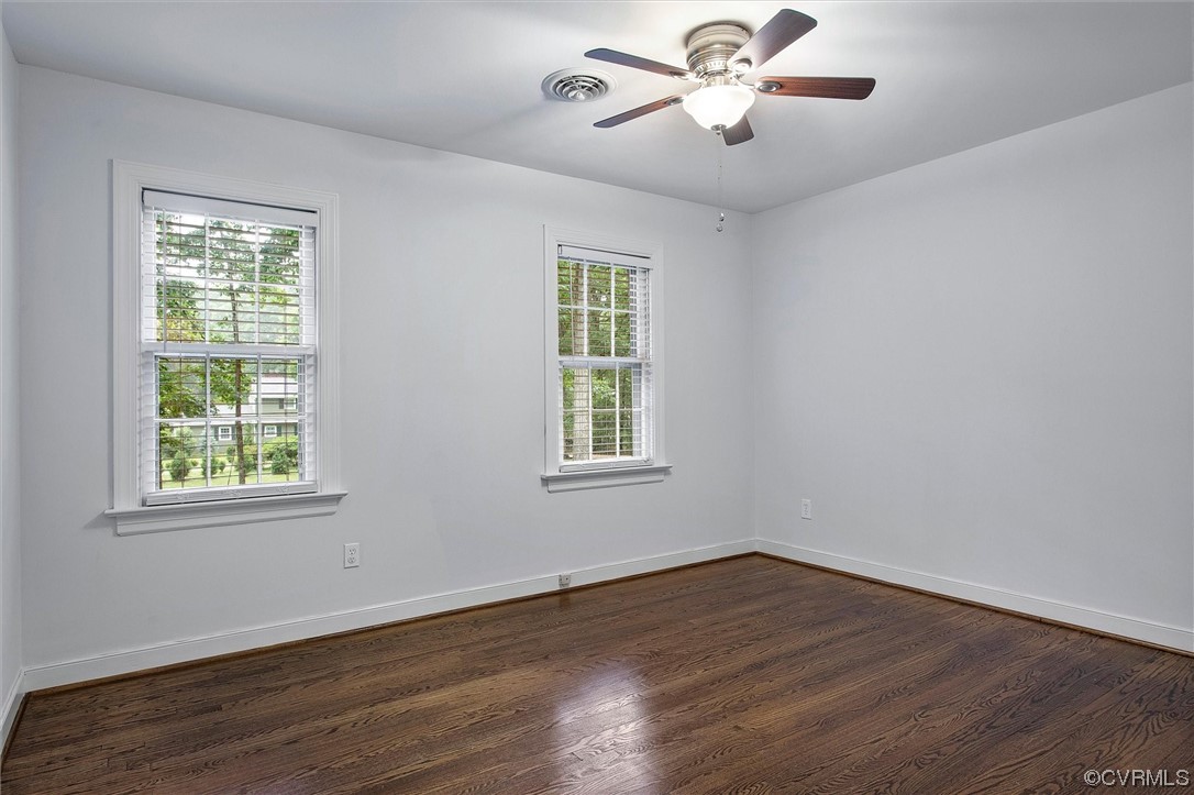 2301 Winterfield Road Midlothian, VA 23113 - Photo 41 of 50 a view of an empty room with wooden floor and a window