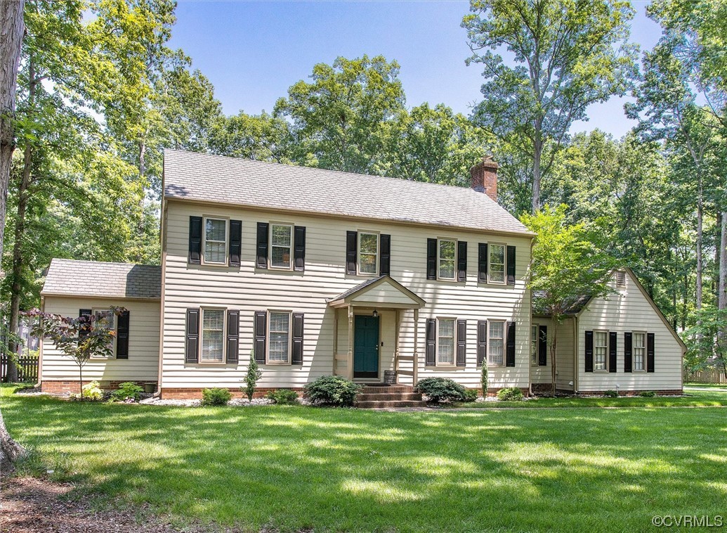 2301 Winterfield Road Midlothian, VA 23113 - Photo 5 of 50 a front view of a house with a garden