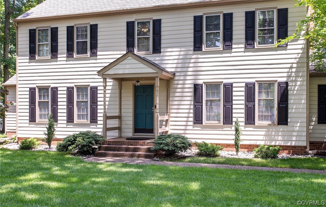 2301 Winterfield Road Midlothian, VA 23113 - Photo 6 of 50 a front view of a house with a yard
