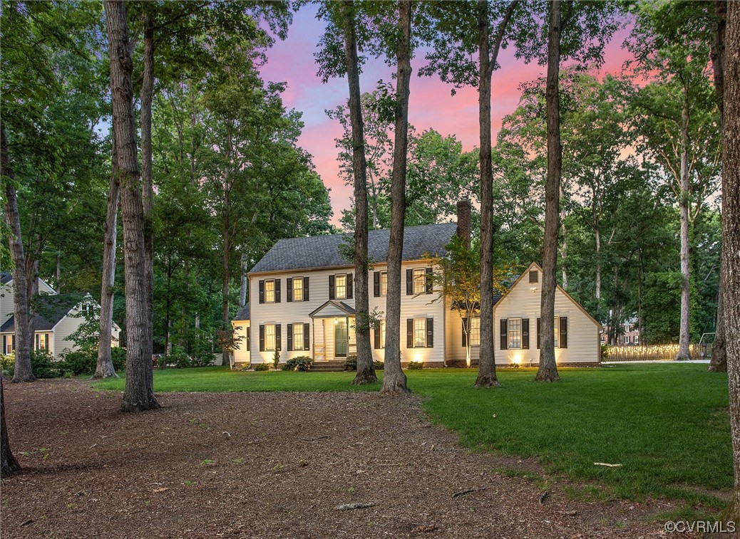 2301 Winterfield Road Midlothian, VA 23113 - Photo 9 of 50 a view of a white house with a big yard and large trees