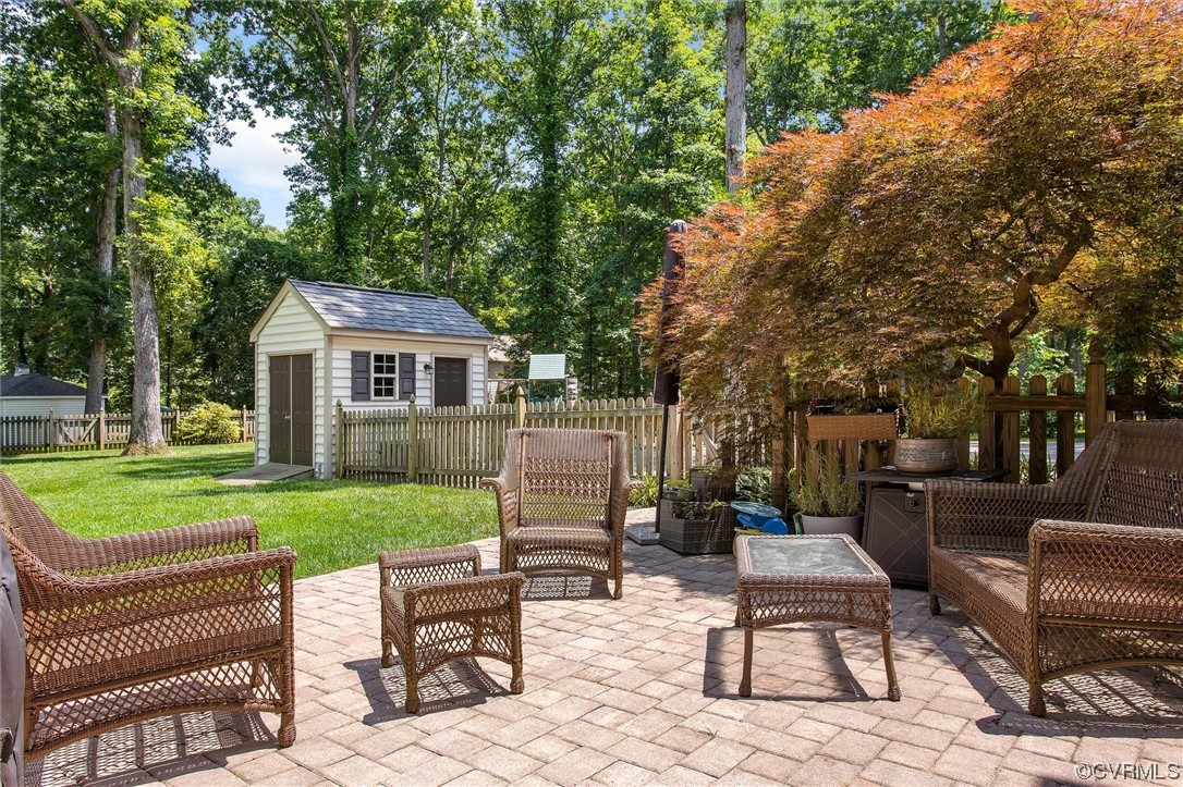 2301 Winterfield Road Midlothian, VA 23113 - Photo 10 of 50 a view of a house with a backyard and a patio