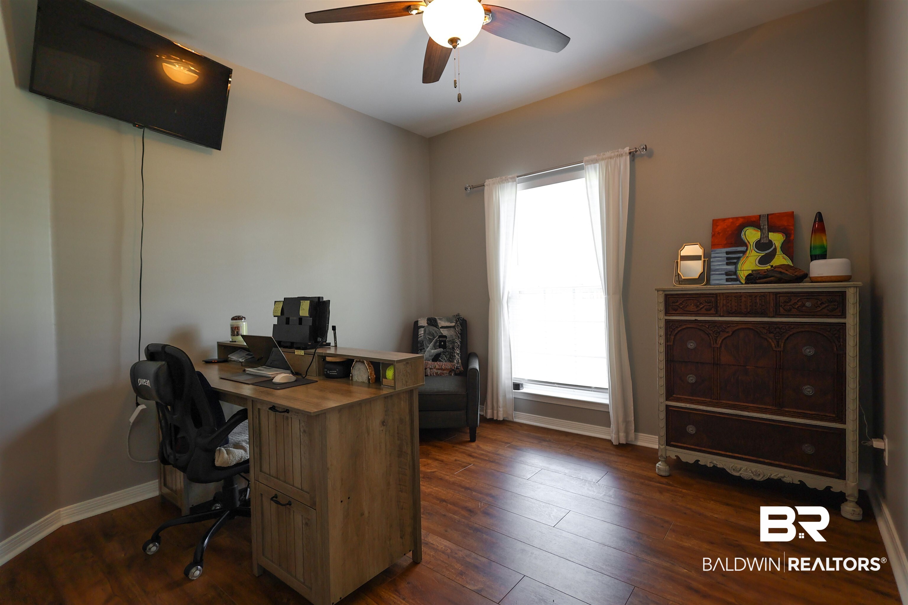5151 Beatrice Road Gulf Shores, AL 36542 - Photo 34 of 50 Office with ceiling fan and dark wood-style flooring