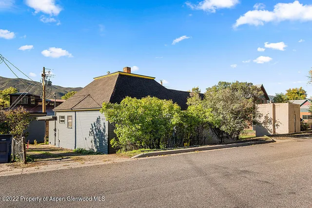 a view of a house with a street