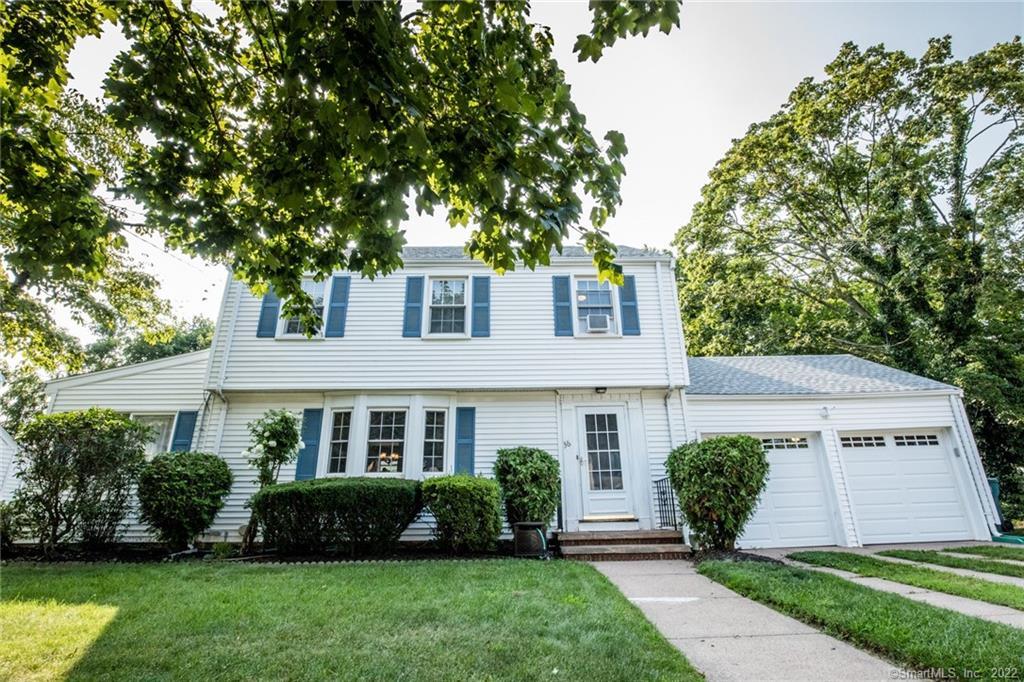 36 Rochford Avenue Hamden, CT 06514 - Photo 1 of 1 Newer windows and roof, vinyl siding on a tree line street with sidewalks.