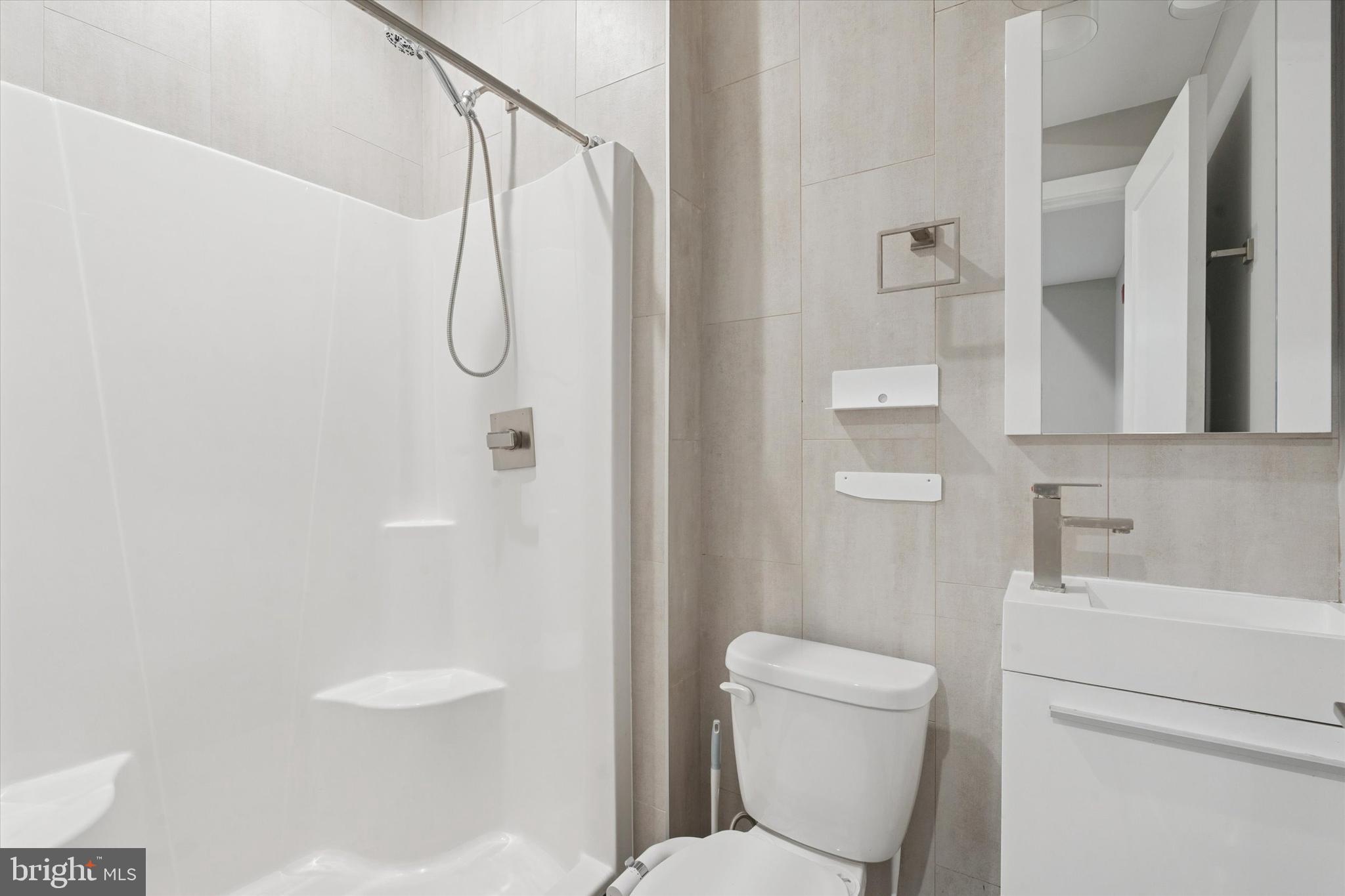 3817 Wallace Street Philadelphia, PA 19104 - Photo 13 of 25 a bathroom with a toilet and a shower