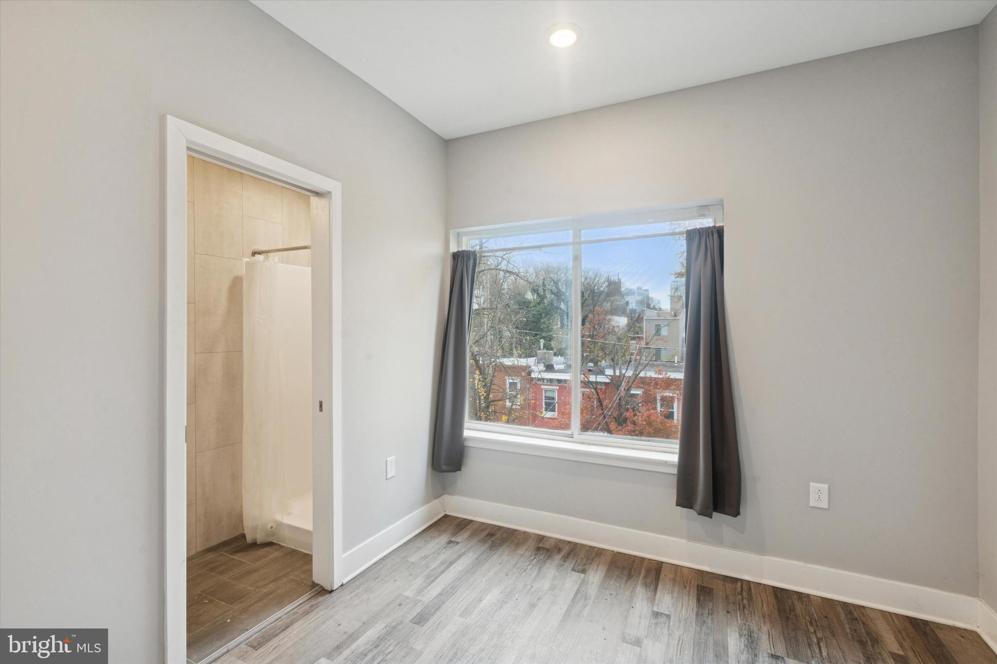 3817 Wallace Street Philadelphia, PA 19104 - Photo 17 of 25 a view of an empty room with glass door and a window