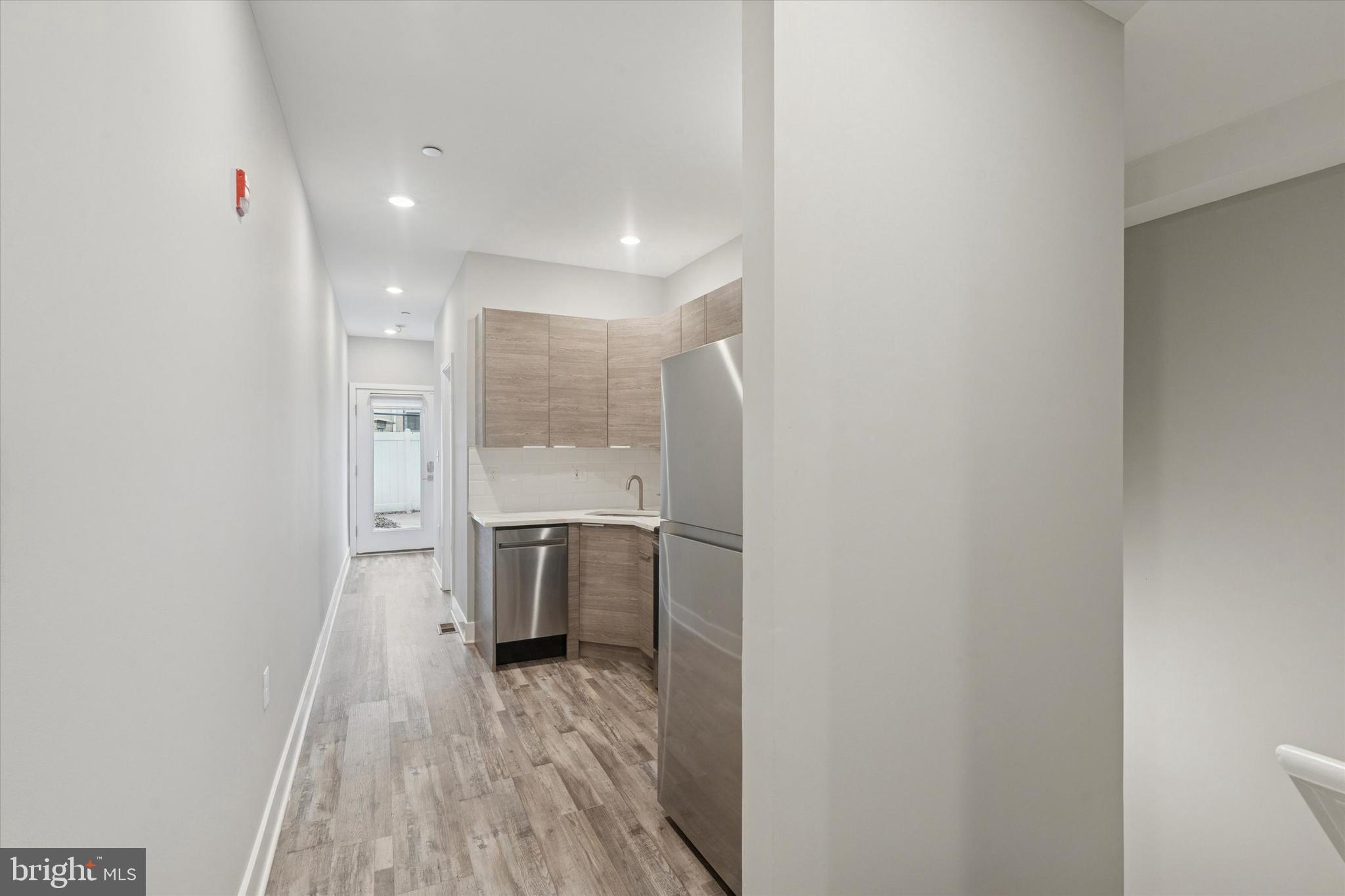 3817 Wallace Street Philadelphia, PA 19104 - Photo 3 of 25 a bathroom with a sink and a walk in closet