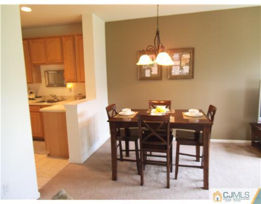 5 Stony Hill Road Jamesburg, NJ 08831 - Photo 4 of 17 a view of a dining room with furniture and chandelier
