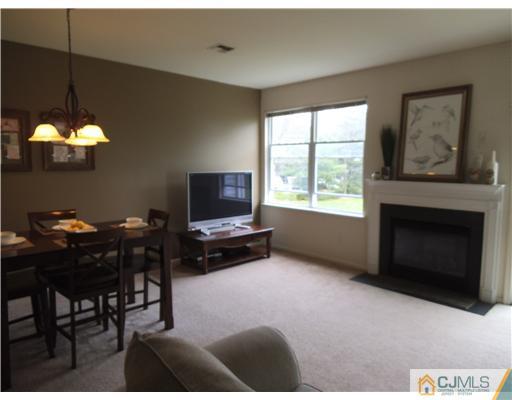 5 Stony Hill Road Jamesburg, NJ 08831 - Photo 6 of 17 a living room with furniture a window and a fireplace