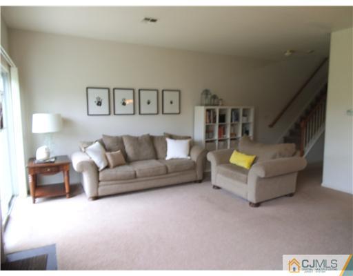 5 Stony Hill Road Jamesburg, NJ 08831 - Photo 9 of 17 a living room with furniture and a lamp