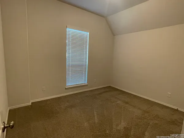 a bathroom with a bathtub shower sink vanity and toilet