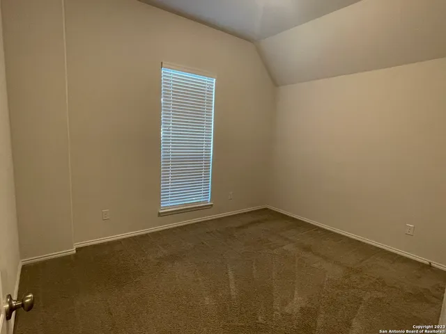 a bathroom with a bathtub shower sink vanity and toilet